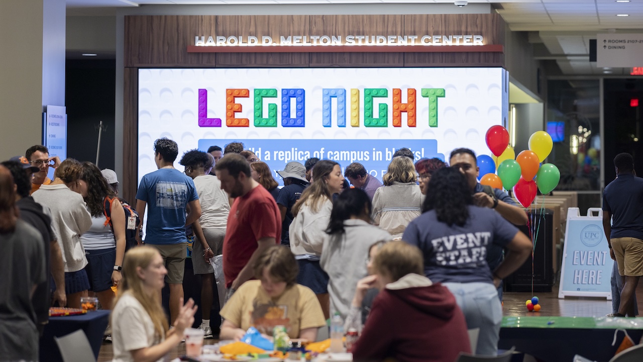 a crowd of students gathered inside melton student center for lego night