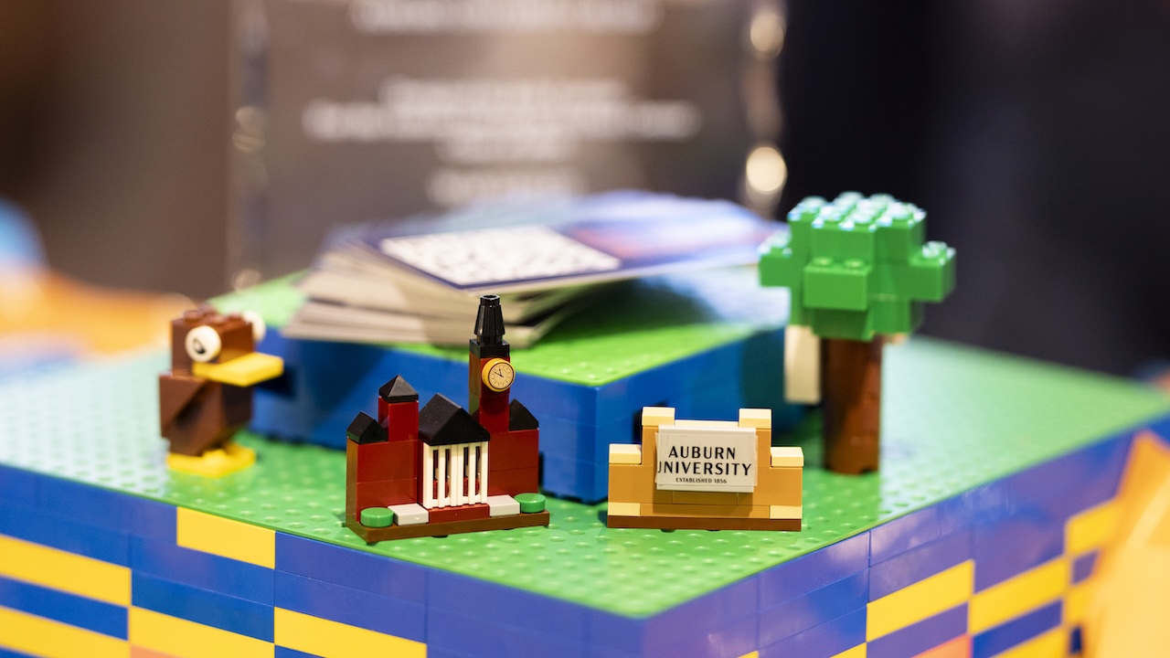 four lego models, an eagle, samford hall, the Auburn University sign and a toomers oak, offered to students at Lego Night