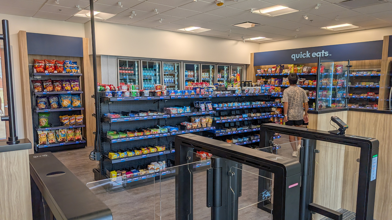 A students browses grab and go food options inside the central market
