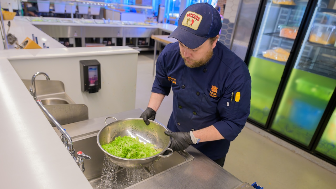 chef washing lettuce