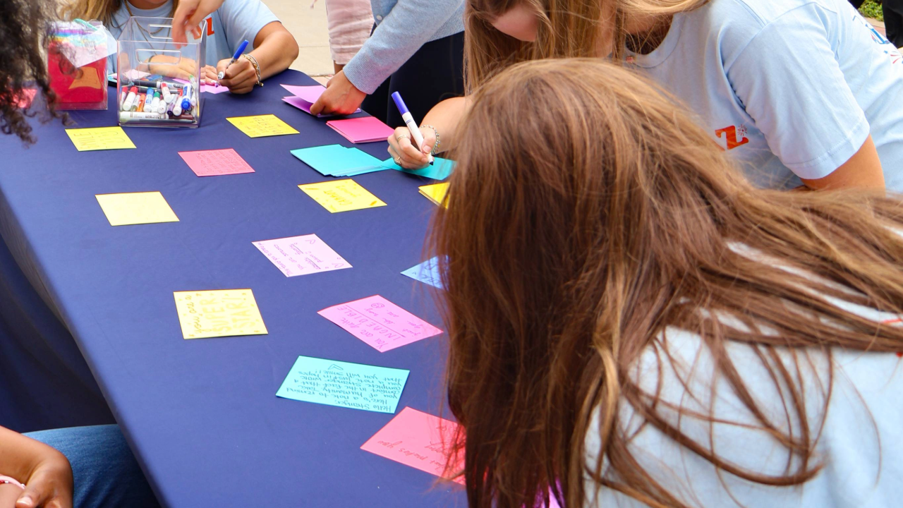 student facing table writing an encouraging note