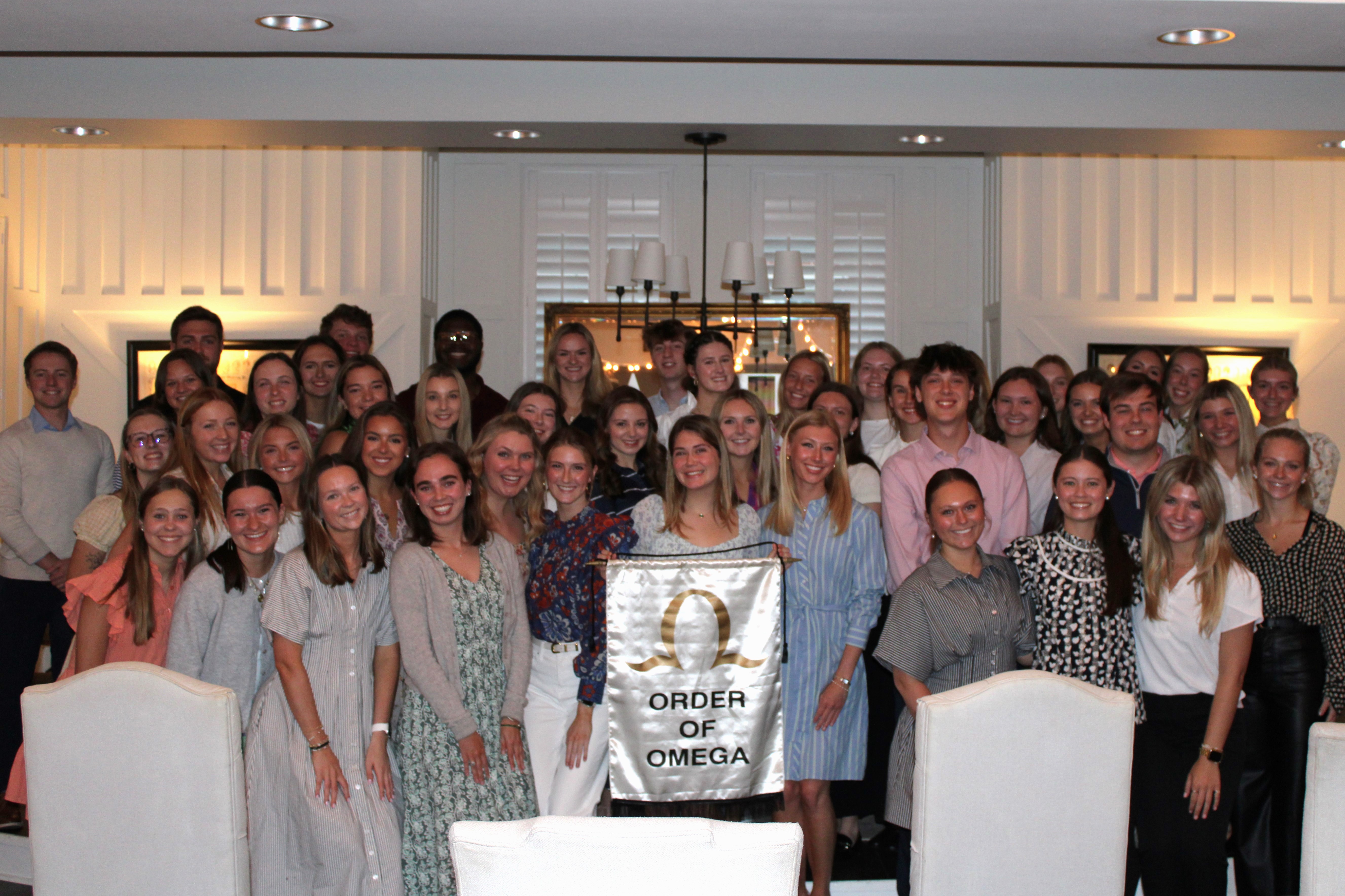 order of omega group photo