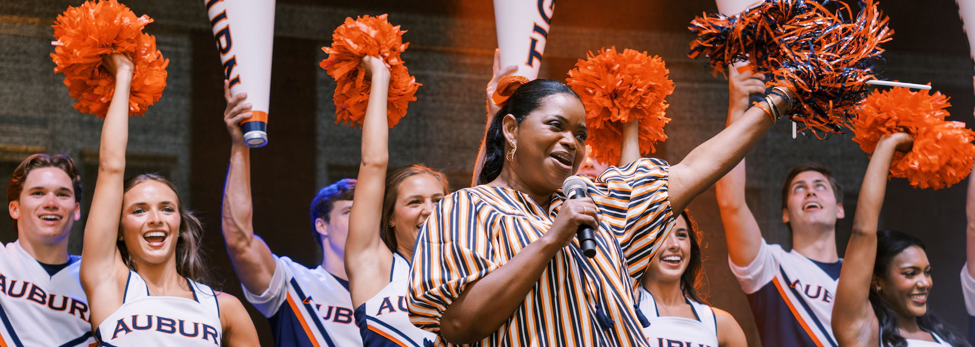 Octavia Spencer leading a cheer with the Auburn cheerleaders