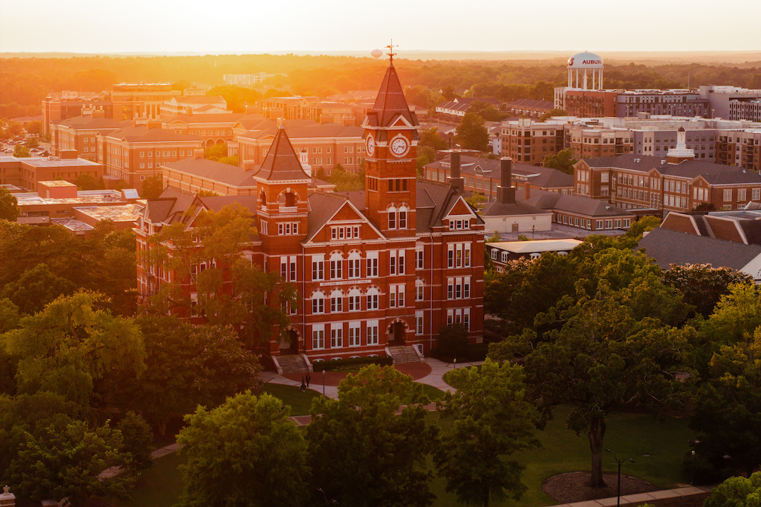 Samford Hall at sunset shot by a drone