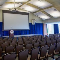 Student center ballroom with chairs and stage