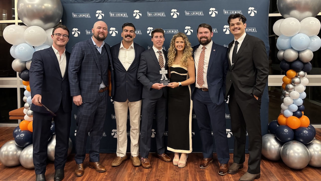 ASVA members pose with the Fred and Charlene Kam "Human Touch" Service award